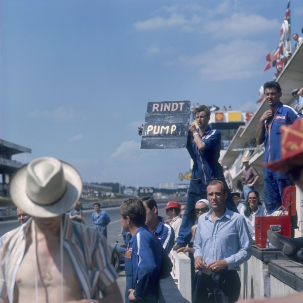 A mechanic holding up a sign, French Grand Prix, Le Mans, France, 1967. Artist: Unknown