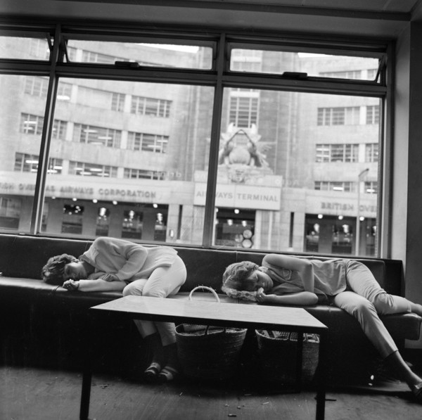 Women asleep in a waiting area, BOAC Air Terminus, London, 1960-1972
