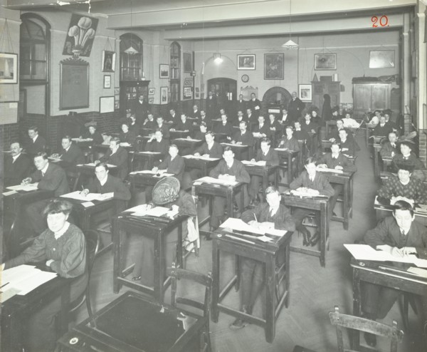Examination class for male and female students, Queen's Road Evening Institute, London, 1908. Artist: Unknown.