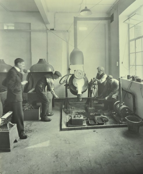 Men pouring molten metal in a foundry, School of Engineering and Navigation, London, 1931. Artist: Unknown.