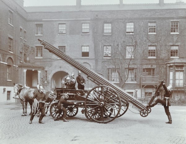 Firemen demonstrating a horse-drawm escape vehicle, London Fire Brigade Headquarters, London, 1910. Artist: Unknown.