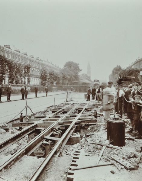 Workmen extending tramlines, Brixton Road, London, 1907. Artist: Unknown.