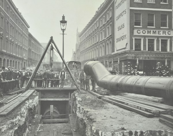 Replacing an old gas main, Commercial Street, London, 1906. Artist: Unknown.