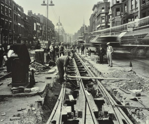Men laying tramlines in the middle of the road, Whitechapel High Street, London, 1929. Artist: Unknown.