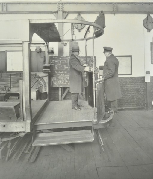 Learner-driver under instruction in a mock-up of tram car cab, London, 1932. Artist: Unknown.