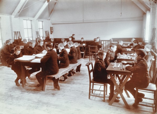 Boys playing dominoes and reading at the Boys Home Industrial School, London, 1900. Artist: Unknown.