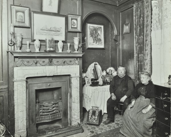 Elderly couple in Victorian interior, Albury Street, Deptford, London, 1911. Artist: Unknown.