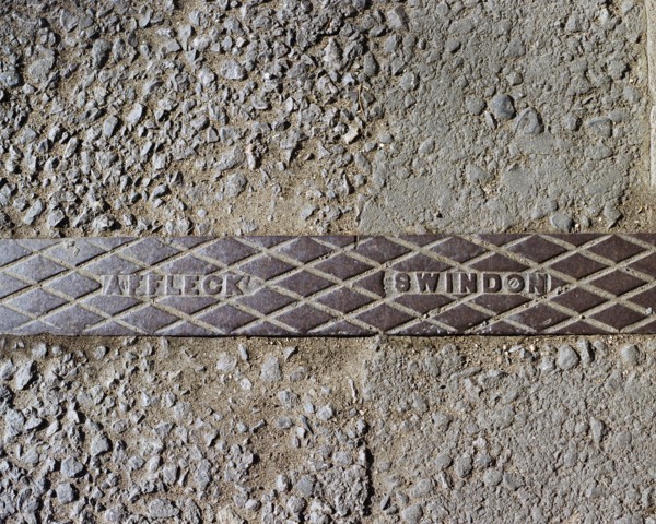 Pavement rainwater gully cover plate made by Affleck of Swindon, Swindon, Wiltshire, 2006