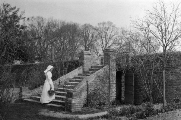 Woman standing at the base of the garden steps, Ufton Court, Ufton Nervet, Berkshire. c1901