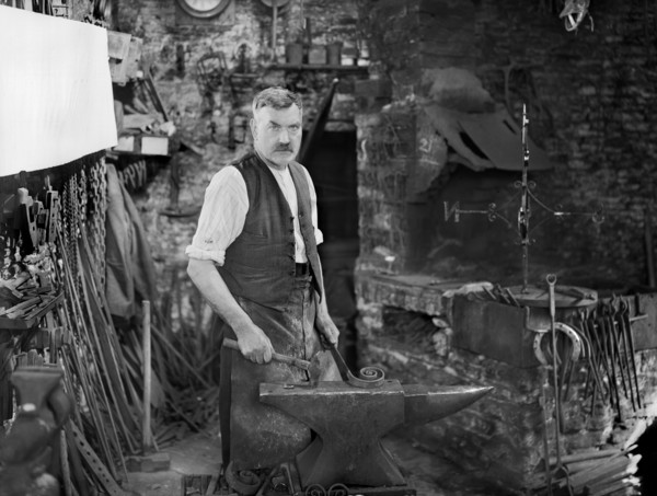 Mr Jefferies at work in the forge, Southrop, Cotswolds, Gloucestershire, 1938