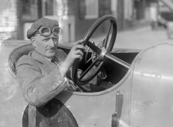 RJ Sully behind the wheel of a HE 14/40, Brooklands. Artist: Bill Brunell.