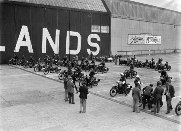 Motorcycles on the start line at the MCC Members Meeting, Brooklands, 10 September 1938. Artist: Bill Brunell.