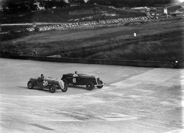 Fiat Balilla and Jensen racing at the BARC Meeting, Brooklands, 15 October 1938. Artist: Bill Brunell.