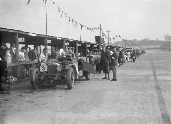 Invicta of FH Cairnes and George Field in the pits at the JCC Double Twelve race, Brooklands, 1931. Artist: Bill Brunell.