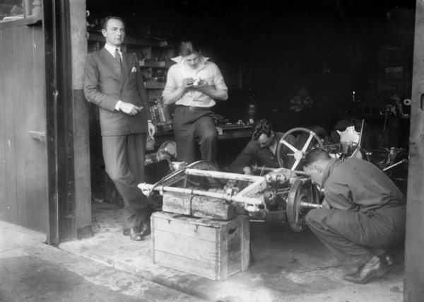 Working on the chassis of Raymond Mays' 2996 cc Vauxhall-Villiers. Artist: Bill Brunell.