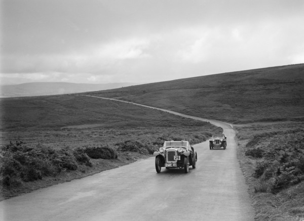 Austin 7 AEW of AL Chard ahead of FG Cornish's MG TA at the MCC Torquay Rally, July 1937. Artist: Bill Brunell.