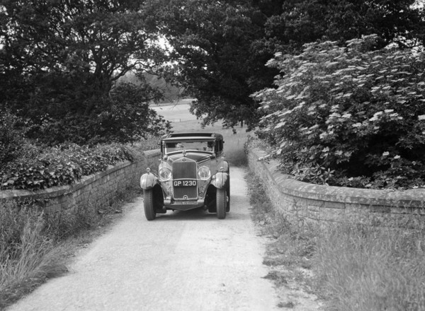 Kitty Brunell road testing a 1931 Delage D8. Artist: Bill Brunell.