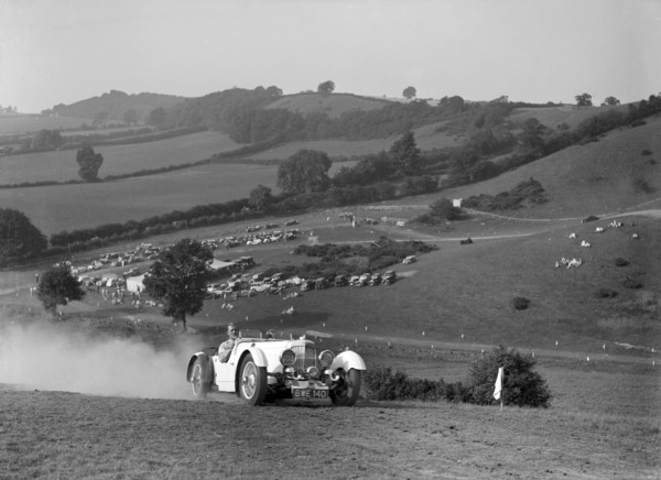Aston Martin competing in the Singer CC Rushmere Hill Climb, Shropshire 1935. Artist: Bill Brunell.