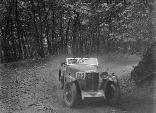 MG Magna competing in the B&HMC Brighton-Beer Trial, Fingle Bridge Hill, Devon, 1934. Artist: Bill Brunell.