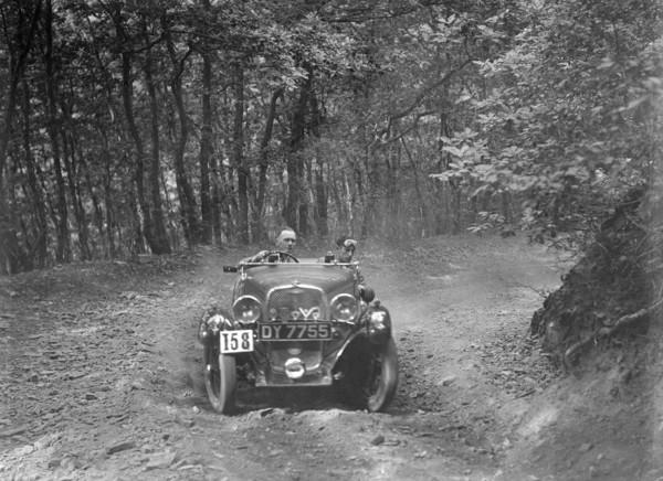 1496 cc Singer competing in the B&HMC Brighton-Beer Trial, Fingle Bridge Hill, Devon, 1934. Artist: Bill Brunell.