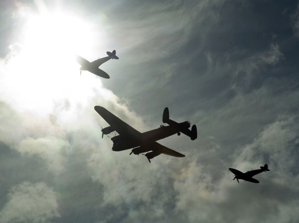 2011 Goodwood Revival Meeting, Lancaster bomber and 2 Spitfires in aerial display. Artist: Unknown.