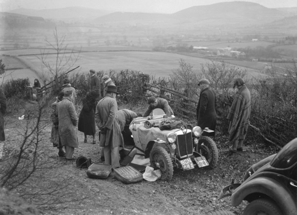 MG PB of K Scales getting a push during the MG Car Club Midland Centre Trial, 1938. Artist: Bill Brunell.