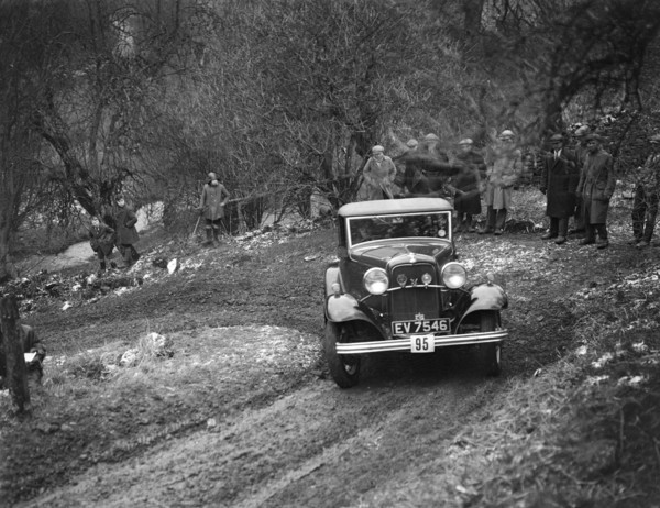 Ford V8 open tourer of H Hillcoat competing in the Sunbac Colmore Trial, Gloucestershire, 1933. Artist: Bill Brunell.
