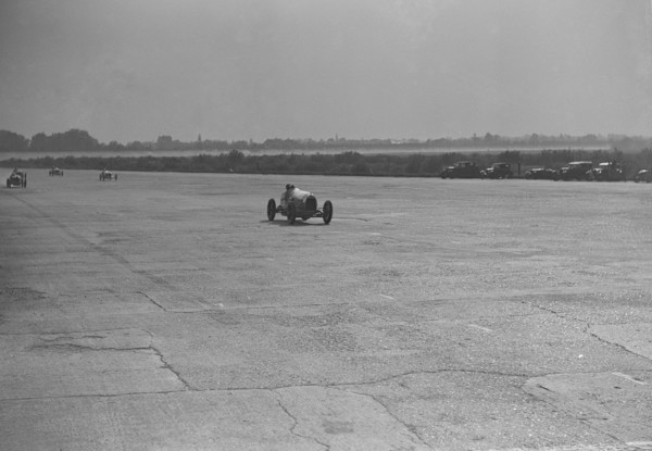 Delage racing at a Surbiton Motor Club race meeting, Brooklands, Surrey, 1928. Artist: Bill Brunell.