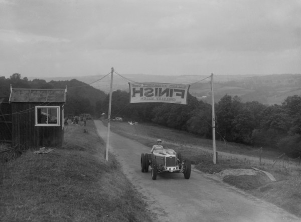 Riley finishing the Shelsley Walsh Hillclimb, Worcestershire, 1935. Artist: Bill Brunell.