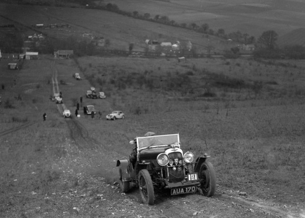 Lagonda Rapier competing in the London Motor Club Coventry Cup Trial, Knatts Hill, Kent, 1938. Artist: Bill Brunell.