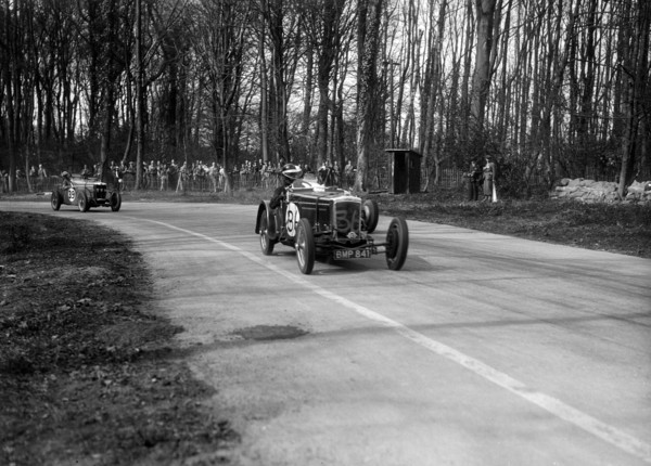 Frazer-Nash Byfleet II leading an MG at Donington Park, Leicestershire, 1935. Artist: Bill Brunell.