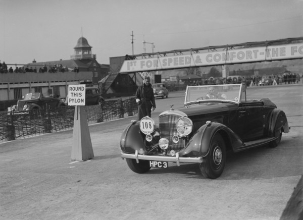 Bentley 4-seater tourer of GG Wood competing in the JCC Rally, Brooklands, Surrey, 1939. Artist: Bill Brunell.