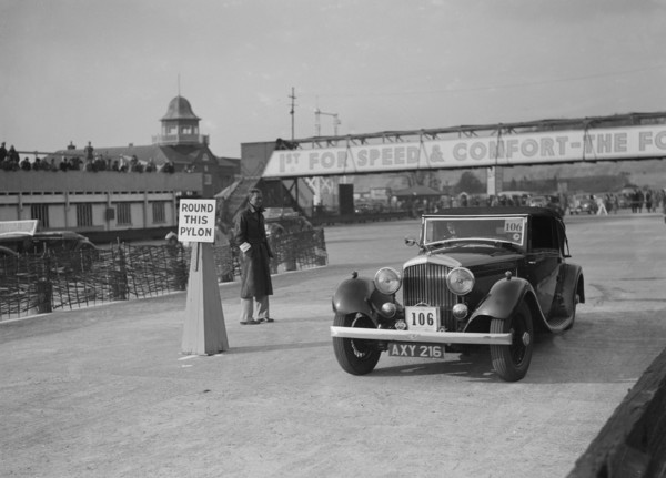 Bentley drophead coupe with Barker body competing in the JCC Rally, Brooklands, Surrey, 1939. Artist: Bill Brunell.