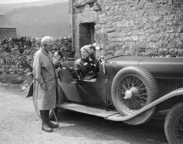 Kitty Brunell in a MG 18/80 open 4-seater, c1930(?). Artist: Bill Brunell.