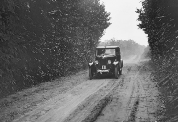 Riley Monaco saloon competing in the Brighton & Hove Motor Club Trial, 1920s. Artist: Bill Brunell.