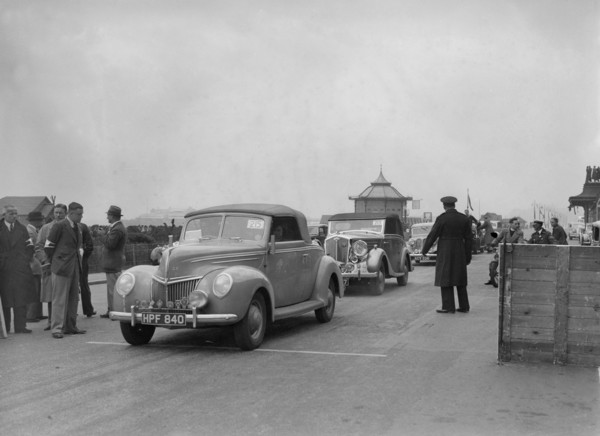 Ford V8 drophead of DB Hall at the RAC Rally, Madeira Drive, Brighton, 1939. Artist: Bill Brunell.