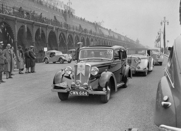 Riley 4-door saloon of AS Bassett at the RAC Rally, Madeira Drive, Brighton, 1939. Artist: Bill Brunell.