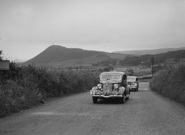 Ford V8 saloon of HJ Parsons competing in the South Wales Auto Club Welsh Rally, 1937 Artist: Bill Brunell.