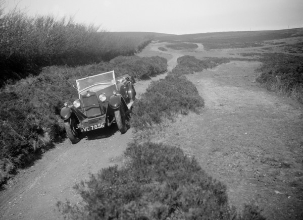 Kitty Brunell road testing a Riley 9 tourer, c1930.  Artist: Bill Brunell.