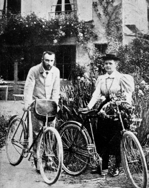 Pierre and Marie Curie, French physicists, preparing to go cycling. Artist: Unknown