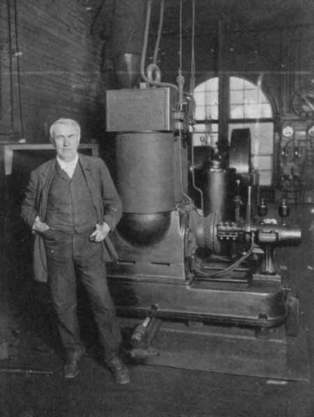 Thomas Alva Edison, American inventor, with his first dynamo for producing electric light, 1880s. Artist: Unknown