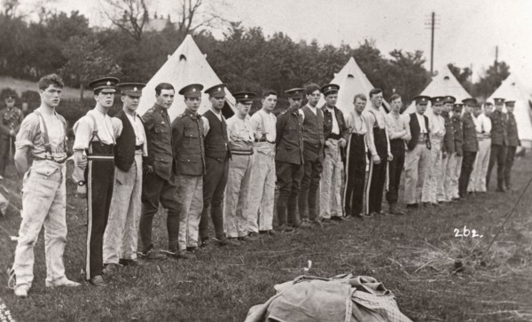 Rowntree boys line up for inspection outside their tents, Coniston, Cumbria, summer 1913. Artist: Unknown