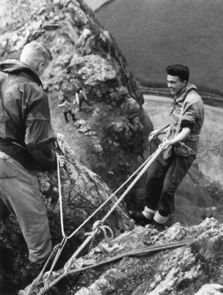 Boy about to start descent of rock face, Outward Bound School, Eskdale, Cumbria,1950. Artist: Unknown