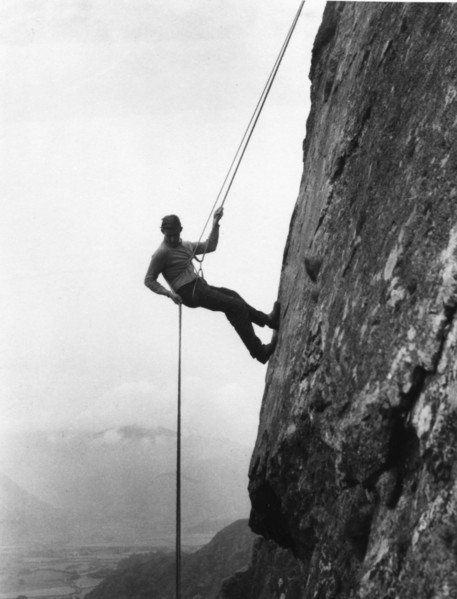Boy abseiling down rock face, Outward Bound School, Eskdale, Cumbria, 1950. Artist: Unknown