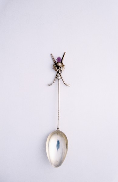 Silver spoon with crossed golf club motif, British, c1920s. Artist: Unknown