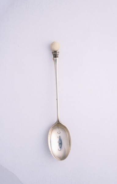 Silver spoon with golf ball motif, c1910. Artist: Unknown