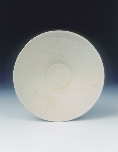 White ware bowl with moulded twin fish and floral pattern, Jin dynasty, China, 12th century. Artist: Unknown