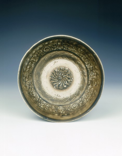 Stoneware bowl with moulded peony scroll and lions, Jin dynasty, China, 13th century. Artist: Unknown