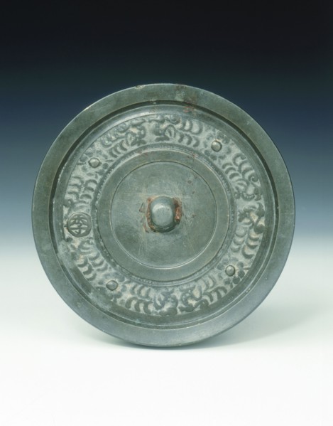 Bronze mirror with multi-armed Avalokitesvara and characters, Yuan dynasty, China, 1271-1368. Artist: Unknown