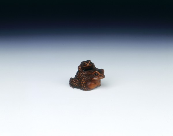 Boxwood netsuke of toad with young, signed by Masanao, Japan, early 19th century. Artist: Masanao